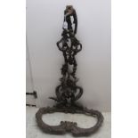 An early 20thC cast iron stickstand with foliate ornament 36''h 22''w BSR