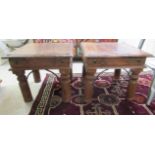 A pair of modern hardwood occasional tables with iron rivets,