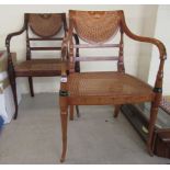 Two similar Regency style Continental inspired mahogany framed open arm chairs,