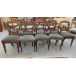 A set of four late Victorian mahogany framed balloon back dining chairs with sage green fabric