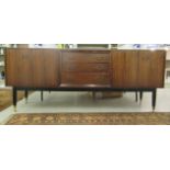 A Grange mahogany sideboard with a central bank of four drawers,