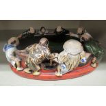 A mid 20thC Japanese high fired porcelain shallow bowl with applied figures 6''w OS3
