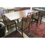 A (possibly Younger Ltd) teak dining table, the rectangular top with curved edges,