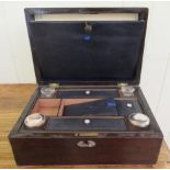 A late 19thC mahogany writing slope with straight sides and a hinged lid and part-fitted interior