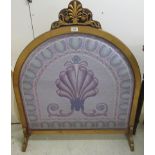 A 20thC gilded plywood framed firescreen with an embroidered panel 41''h 35''w BSR