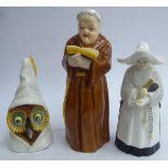 Three Royal Worcester china candle snuffers, viz. a monk 5''h; a nun 3.75''h; and an owl 3.