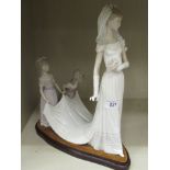 A Lladro porcelain group,