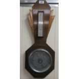 An Art Deco oak cased aneroid barometer,