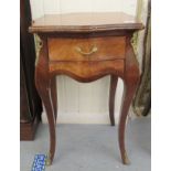 A 20thC reproduction of a Louis XV walnut serpentine outlined work table with applied gilt metal