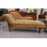 A late Victorian mahogany showwood framed chaise lounge,