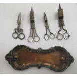 Three similar pairs of 19thC scissor action candle wick trimmers and a tray;