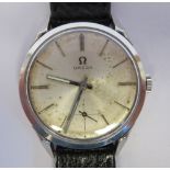 A 1950s Omega stainless steel cased wristwatch, the automatic movement faced by a baton dial,