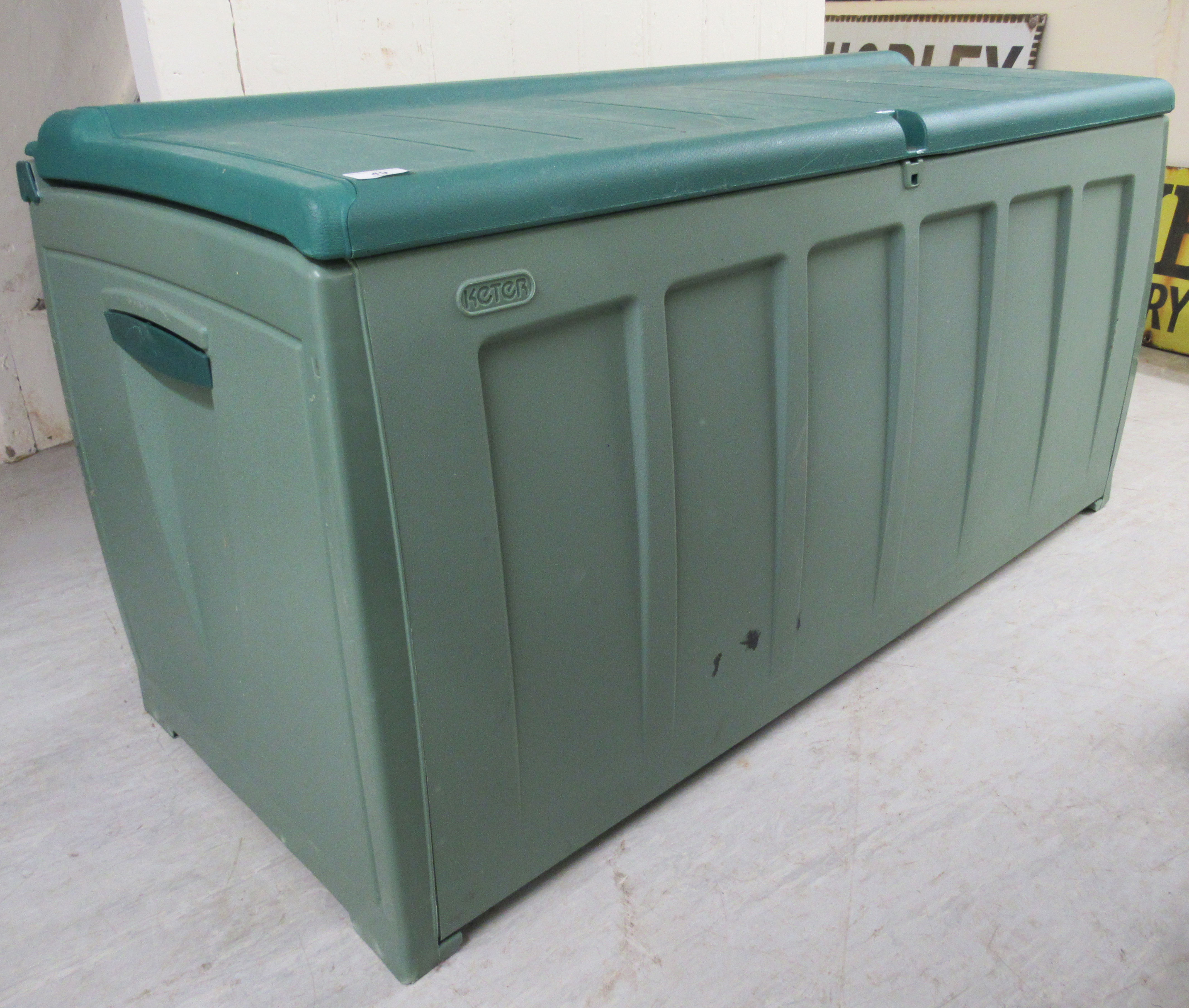 A B&Q two-tone green plastic outdoor storage box 25''h 48''w BSR