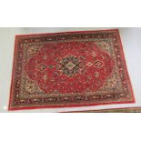 An American Saruk rug, decorated with a central diamond shaped medallion,