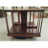 An Edwardian mahogany table-top revolving bookcase,