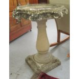 A composition stone bird bath,