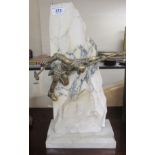 A mid 20thC novelty sculpture, the mottled marble fashioned as mountainous rock,