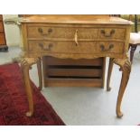 An early 20thC walnut and mahogany serpentine front two drawer canteen chest,