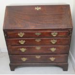 A George III mahogany bureau, the fall-flap over four graduated drawers,
