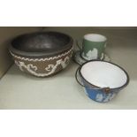 A 19thC brown glazed stoneware footed bowl with a pewter liner,