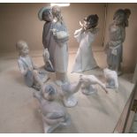 Six Lladro porcelain figures and animals: to include a young woman holding a lamb 9''h;