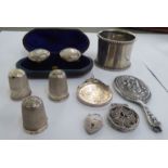 Silver items: to include a miniature hand mirror; two thimbles; and a filigree worked,