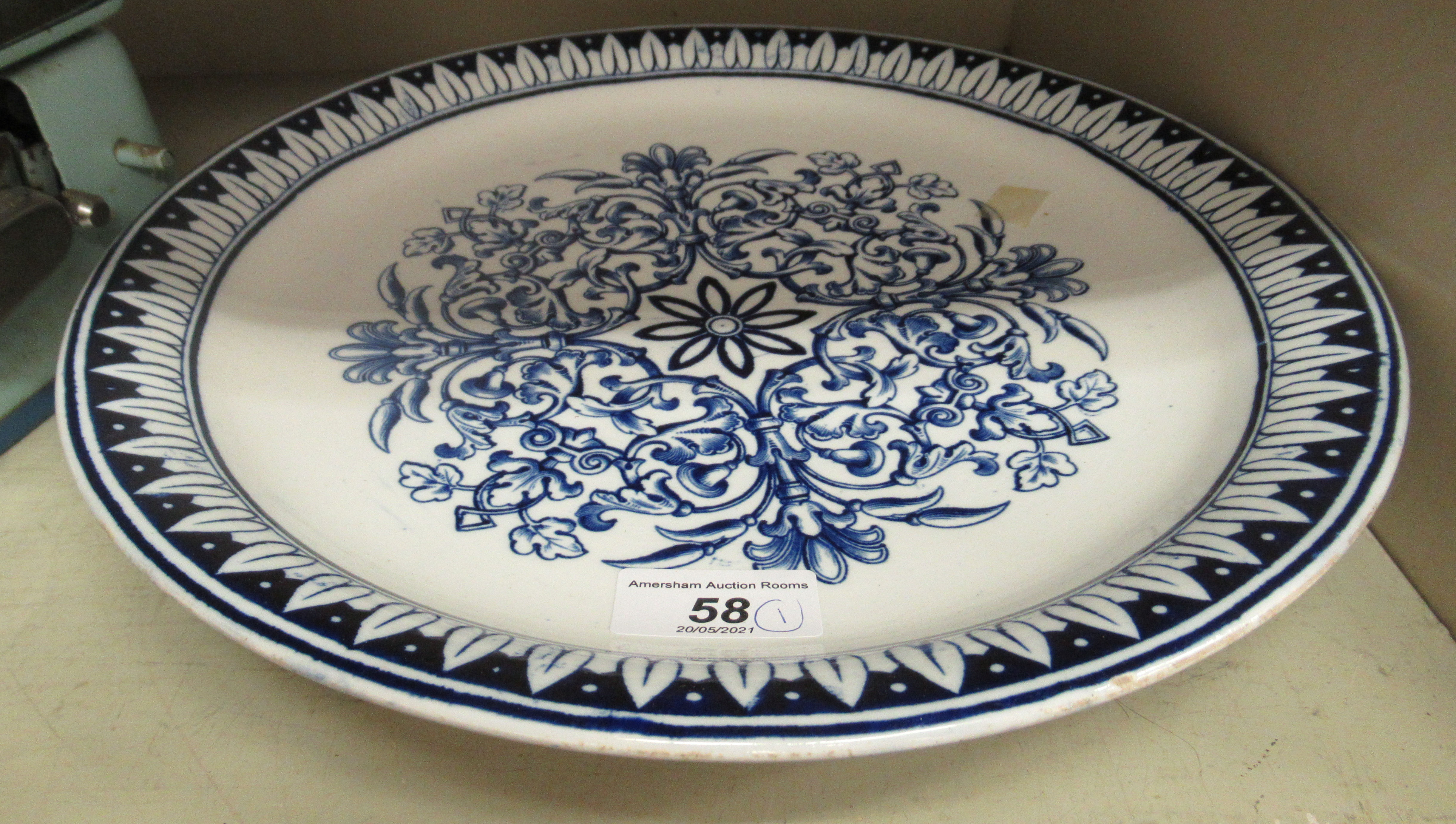 A late Victorian china serving dish, elevated on a deep footrim,