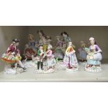 Seven early 20thC Continental porcelain figures: to include a Sitzendorf group,