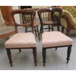 A pair of late Victorian mahogany waisted spoonback dining chairs,