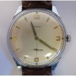 A 1950s Doxa oversize cal 942 stainless steel cased wristwatch, faced by an Arabic and baton dial,