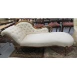 A late Victorian bleached and carved walnut showwood framed chaise lounge,