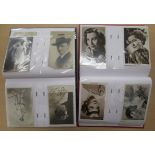 Two uncollated albums containing early 20thC postcards relating to period movie and stage stars