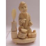 A late 19th/early 20thC Japanese carved ivory figure,