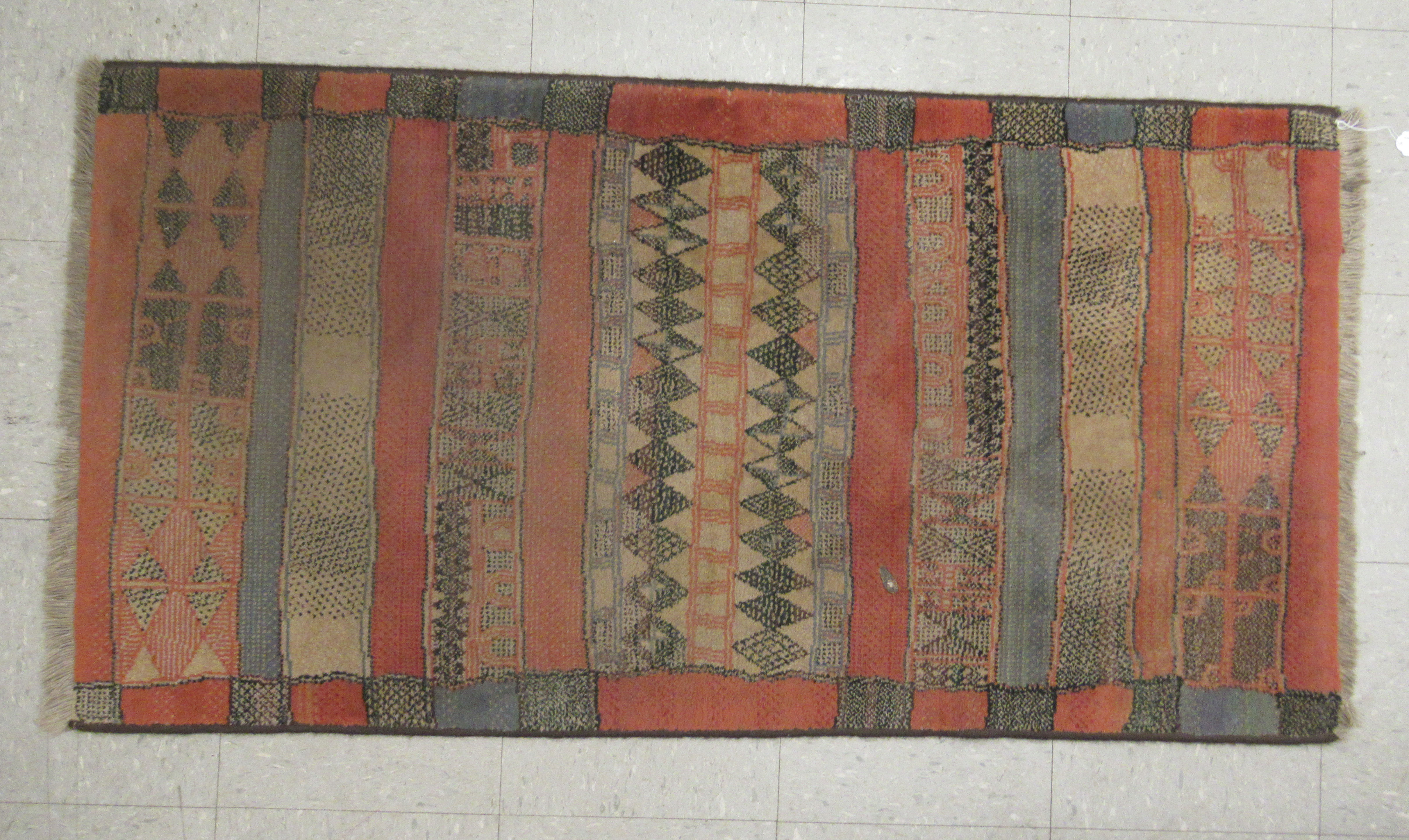 A Caucasian rug with a geometric pattern,