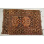 A Persian rug, decorated with block motifs,