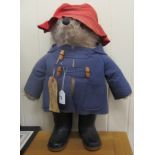 A mohair covered 'Paddington Bear' with a red fabric hat,