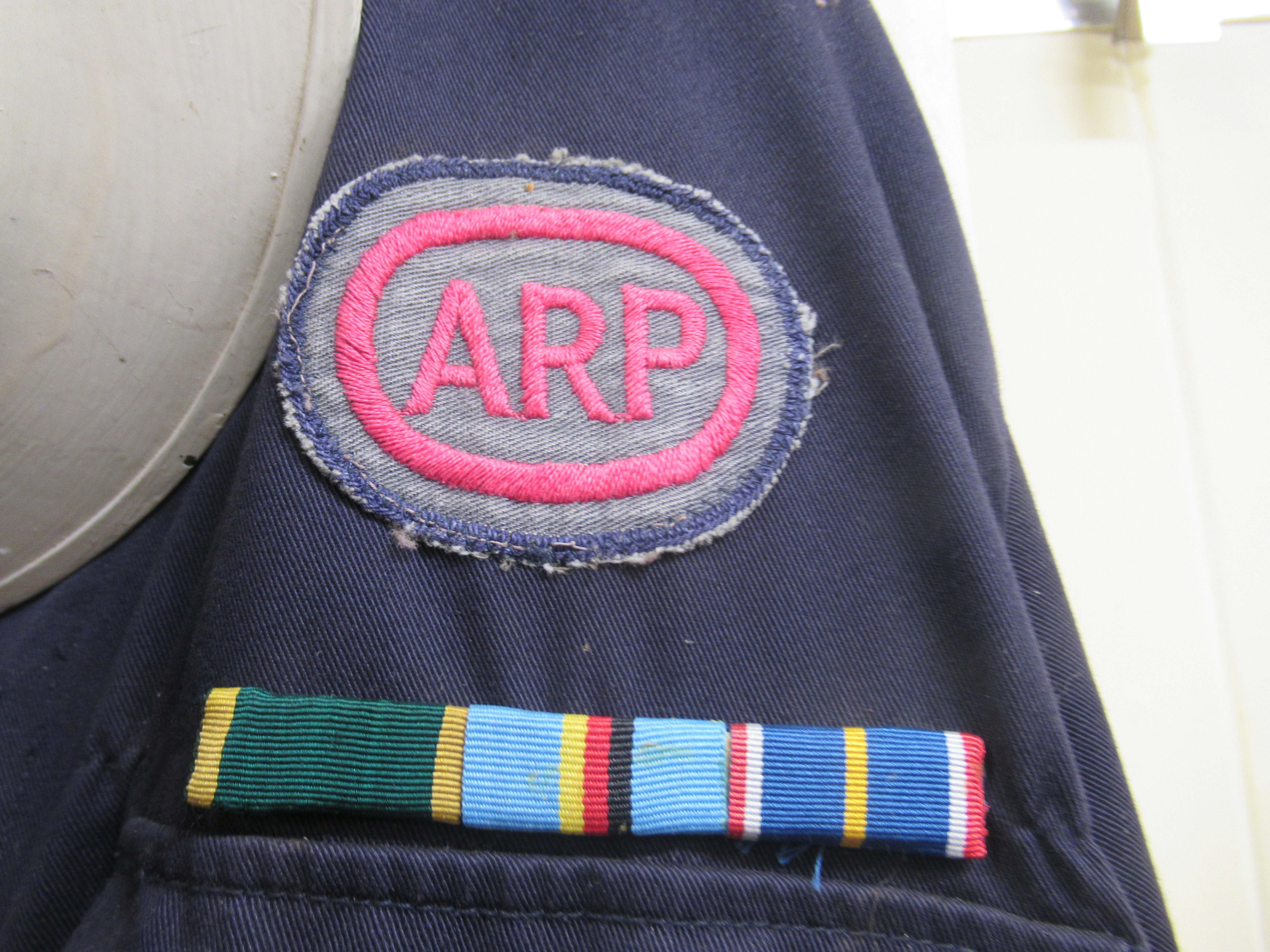 A World War II and later painted warden's helmet and ARP overalls (Please Note: this lot is - Image 2 of 3