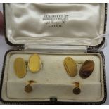 A pair of 9ct gold oval cufflinks with matching studs with engine turned ornament cased 11