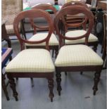 A set of four mid Victorian mahogany framed balloon back dining chairs,