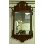 A 20thC Regency style pier glass, the plate set in a fret carved mahogany frame 30"h 15.5"w