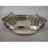 An early 20thC silver plated deskstand, the pierced galleried tray incorporating a pen channel and a