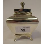 An Edwardian silver plated tea caddy of bulbous, square form with a hinged lid and finial