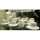 A Wedgwood bone china Spring Morning pattern coffee set comprising five coffee cans and saucers, a