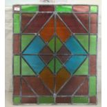 An early 20thC red and green lead glazed window panel 28" x 24"