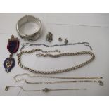 Silver items of personal ornament: to include an engraved, hinged bangle; and a rope link