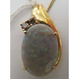 An 18ct gold opal and diamond set pendant, on a fine neckchain and dog-clip clasp