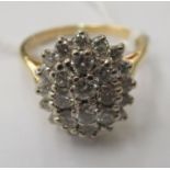 An 18ct gold claw set diamond cluster ring