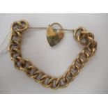 A 9ct gold open curb link chain bracelet, on a padlock clasp and safety chain