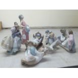 Seven items of Lladro porcelain: to include two children in a rocking crib  7"w; and a young woman