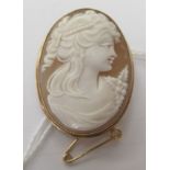 A 9ct gold framed oval, shell carved cameo head and shoulders profile portrait brooch, a maiden with